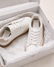 Two 1g silica gel sachets shown inside a sneaker box, one in each shoe